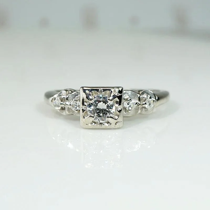 Romantic White Gold Engagement Ring with Floral Details